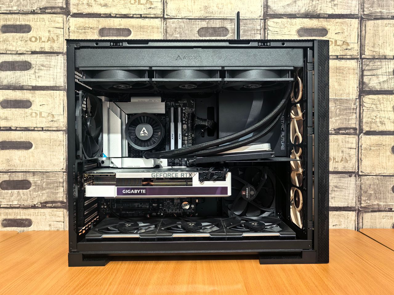 About Detailed view of a custom-built gaming PC with visible components like graphics card and cooling system.