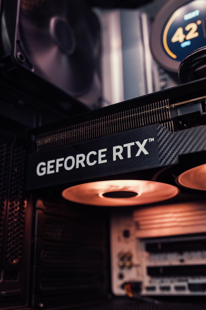 About Detailed view of GeForce RTX graphics card inside a computer, showcasing modern technology.